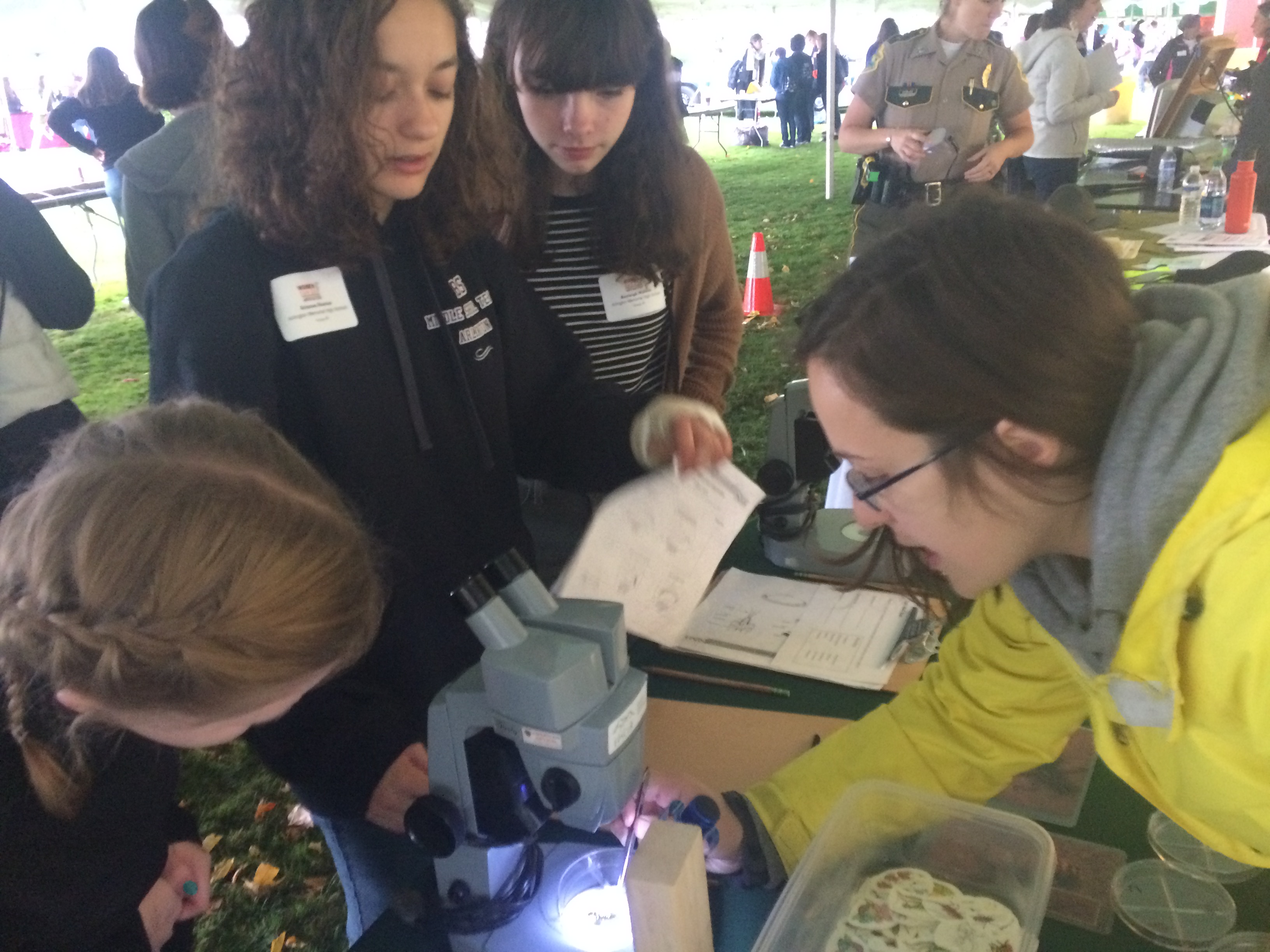 Attendees at the Women Can Do conference examine macroinvertebrates