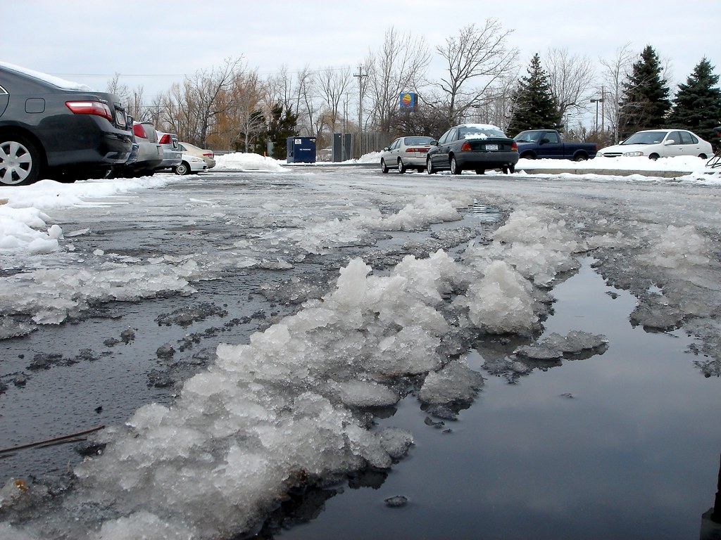 Melting snow in a driveway